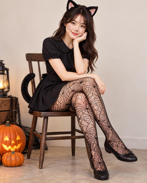 Black spiderweb fishnet tights worn with flat bow shoes